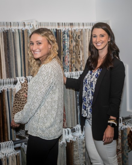 Julianne Newman and designer Caitlin Newman check out fabric samples.