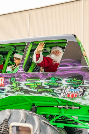 Santa arrives on a monster truck.