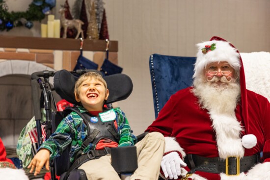 Children share with Santa what they want for Christmas.