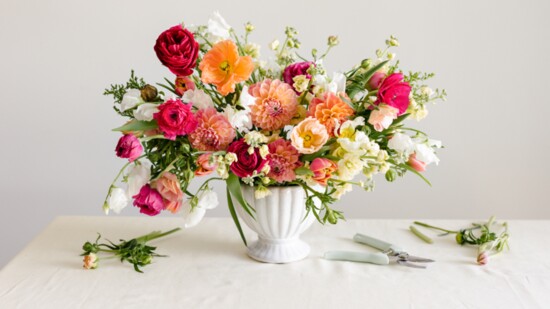 This will be your grid. Forage branches to give height and clip various spring blooms in similar hues to give you an arrangement that feels monochromatic.