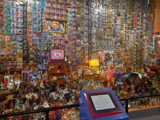 The "Adult Collector's Bedroom Diorama" offers a gentle poke at the stereotypical toy action hero collector living with his parents. Photography Jerri Culpepper