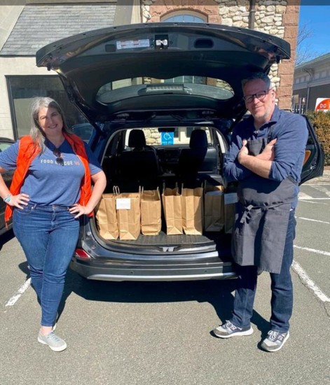 Nicole Straight and Chef Bill Taibe delivering the first meal to Westport EMS.
