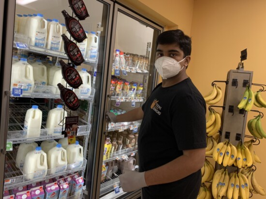 Dhruv Pai grocery shopping before making a delivery through the group he founded, Teens Helping Seniors.