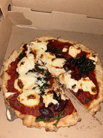 Crust and Crumble's gluten-free pizza with vegan ricotta, basil and Kalamata olives is a staple.