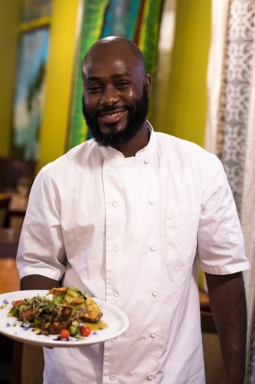 Chef Chervan Desaugauste with a beautifully styled plate of surf combo. 