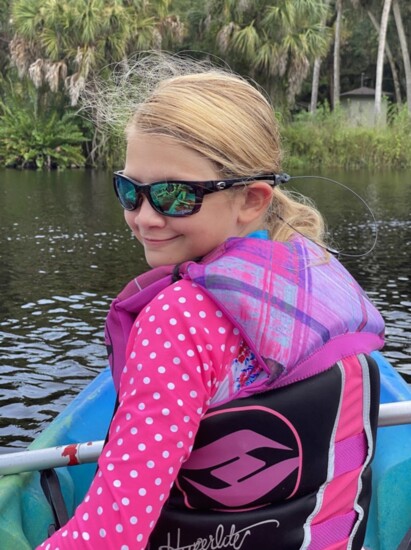 The author's daughter enjoying a kayaking trip.