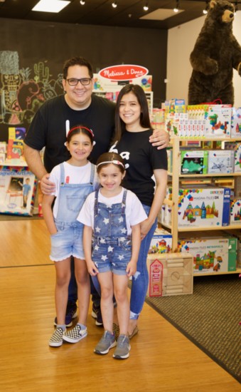 Mauricio and Angela Romy, with daughters Sophia (L) and Zara.