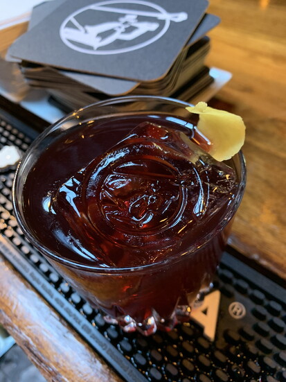 The Doctor's Orders cocktail at The Alley Lightwith elderberry, rye, Fernet Branca, and Punt e Mes vermouth. Photo Credit: Micah LeMon