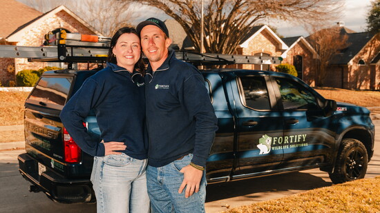 Nathan and Maggie Archibeque with their company truck.