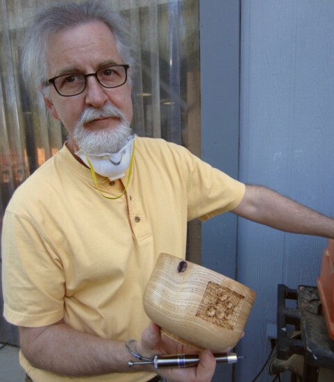 Bob Mosier with a turned wooden piece