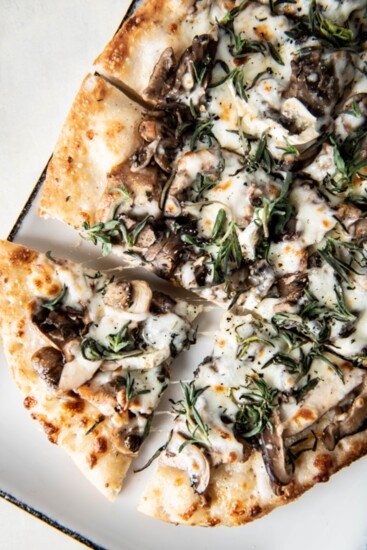 Flatbread with taleggio cheese, mushrooms, arugula and honey-truffle drizzle