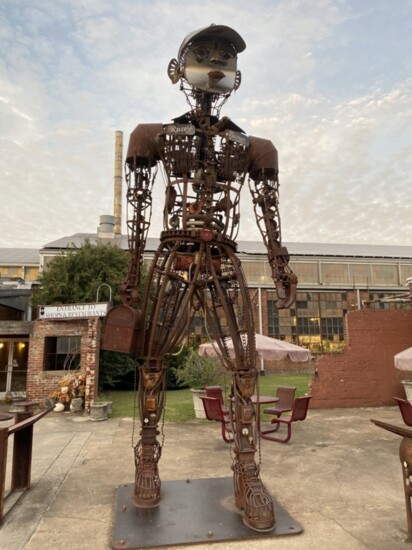 Twenty-foot “Rusty Mechanism” welcomes visitors to one of the few Factory entrances. Soon the buildings will have multiple entrances tied with reimagined outdoo