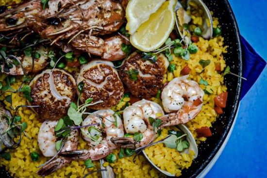 Seafood paella made with Spanish Calasparra rice, saffron, scallops, clams, mussels and head on prawn.