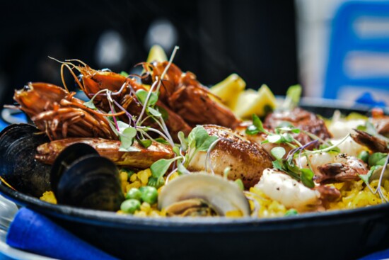 Seafood paella made with Spanish Calasparra rice, saffron, scallops, clams, mussels and head on prawn.