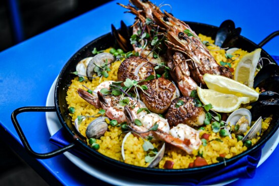 Seafood paella made with Spanish Calasparra rice, saffron, scallops, clams, mussels and head on prawn.