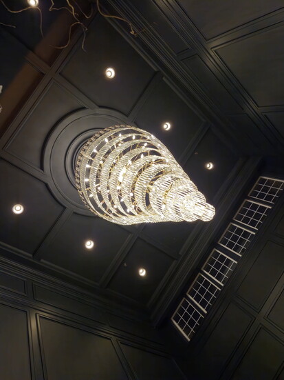 Ornate chandelier at The Publisher Hotel. Photo Credit: Trevor Joppich.