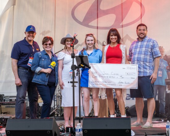 Jen Case accepts a check for $1,000 for winning "Hendersonville Has Talent".