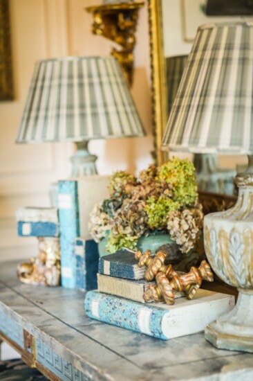 French books in Italian document boxes adorn the phone marble top table from France