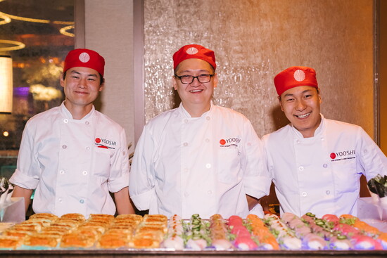 Yooshi Sushi chefs at an event