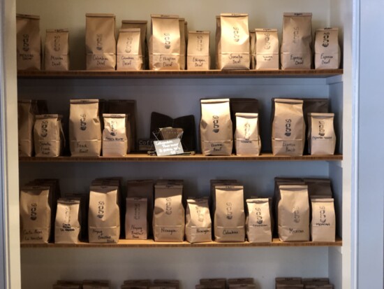Racks of finished coffee products inside So. G Coffee