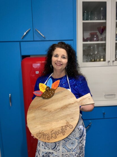 Michelle McElroy- Wooden charcuterie board with interchangeable attachments to be used for all occasions. 