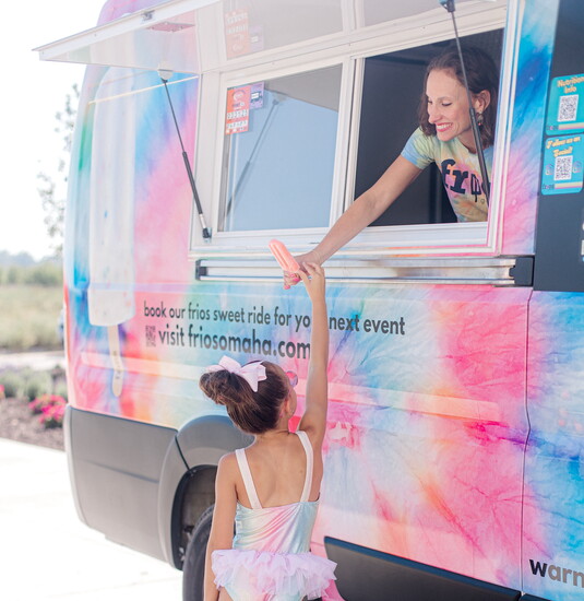 The "Sweet Ride" van is a hit at events with its tye-dye exterior and sweet interior.