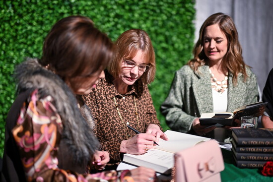 Davis signs books for her fans.