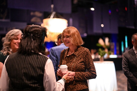 Fiona Davis visits with fans while signing books.