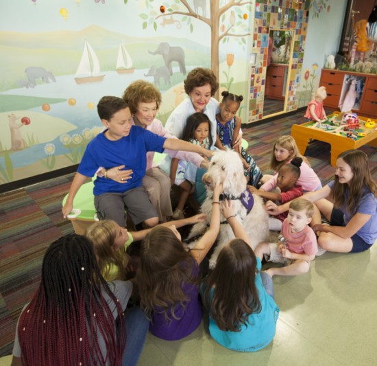 Sara, Yvonne and children enjoy time with a four-legged therapist at the Childhelp Children’s Center of Arizona, a place of hope and healing.
