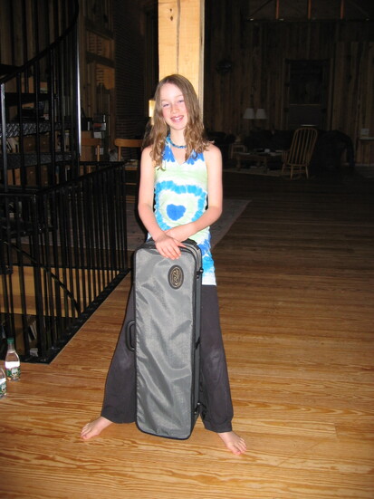 Bronwyn Keith-Hynes as a child holding her fiddle in a case. Photo courtesy of Bronwyn Keith-Hynes.