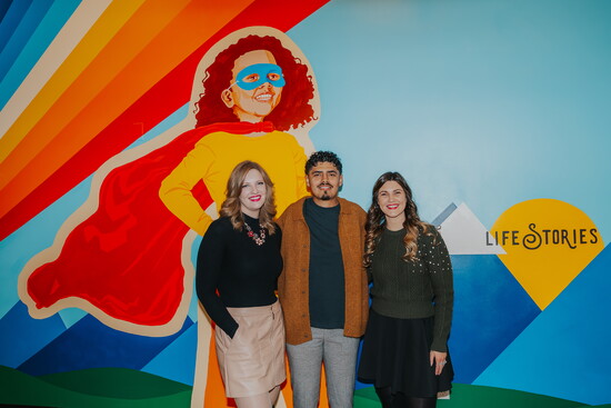 Celebrating community and creativity: Life Stories staff Susan McKenzie and Mattie Falk with mural artist Alonzo Harrison.