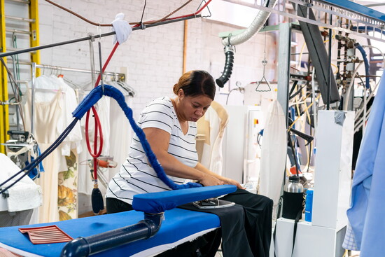 An employee inside The French Cleaners