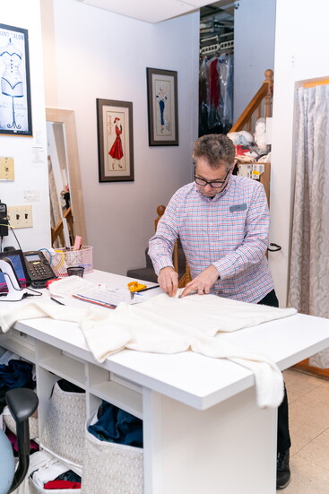 A tailor at work inside The French Cleaners