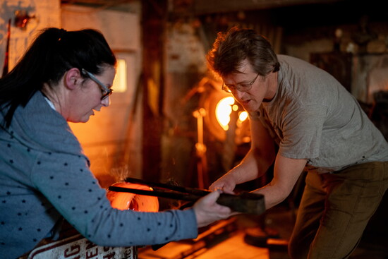 Gabby Kerson and Anson Parker working together at Raging Buffalo Glass. Photo Credit: Sanjay Suchak.