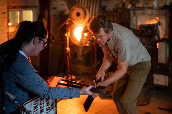 Gabby Kerson and Anson Parker working together at Raging Buffalo Glass. Photo Credit: Sanjay Suchak.
