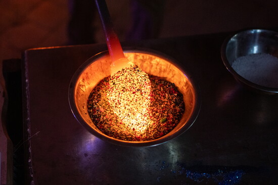 Glass being gathered. Photo Credit: Sanjay Suchak.