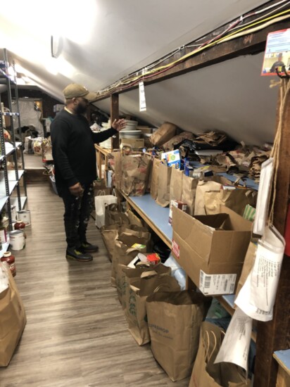 Antwayn in the food pantry of Gillespie.