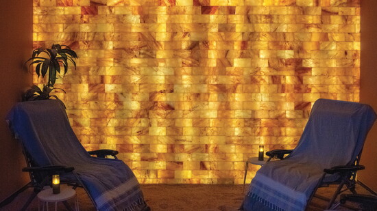 Taking deep breaths in the salt lounge encourages respiratory health while conditioning the skin.