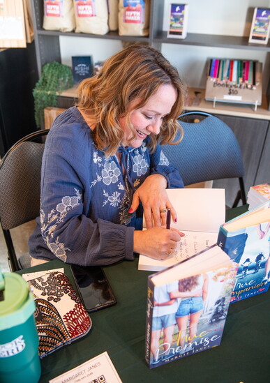 Margie Janes celebrates the release of her second novel at the Book Bar in Mokena