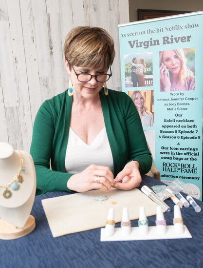 Shelby Koester works on her latest jewelry creation.
