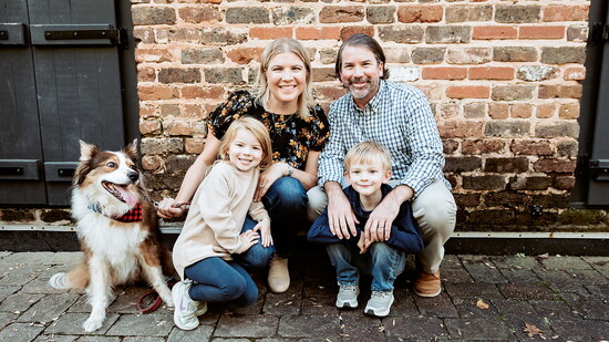 Emily, Kenneth, Noah and Lena Shields with their dog, Ruby.