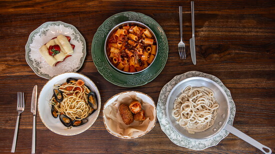 A spread of plated dishes showcases the range of Bottega Salaria's menu, from handmade pasta to seasonal Roman specialities.