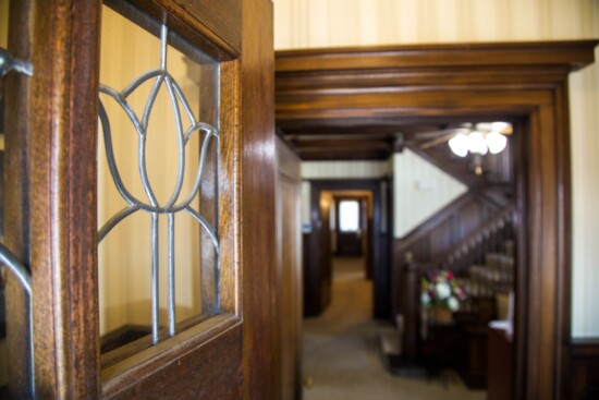 Hand cut leaded glass windows in the "tulip and lily" style. 