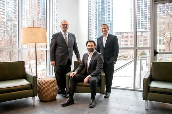 Avli co-owners Louie Alexakis, Ian Vlahakis (seated) and Lou Canellis (Photo credit Mac Yellek)