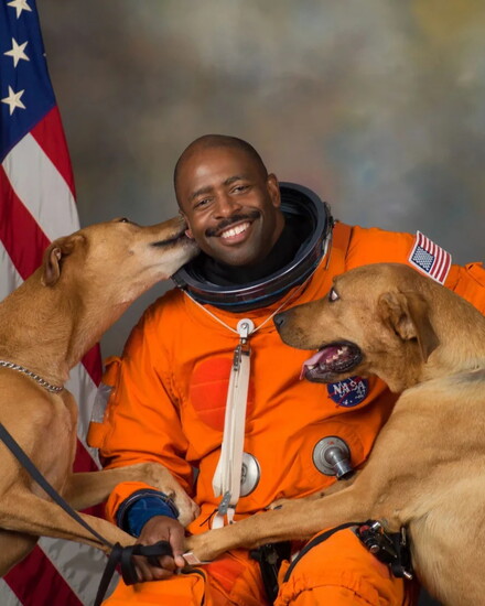 Leland Melvin and his dogs (Official NASA portrait; courtesy of NASA)