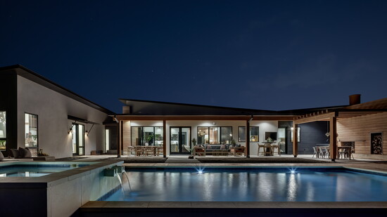 The pool perfectly incorporates the home's design elements with a focus on gathering spaces.
