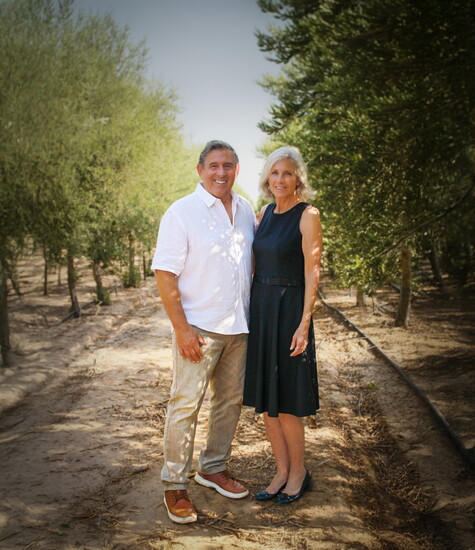 Perry and Brenda in the olive grove. Photo: Anissa Kennedy