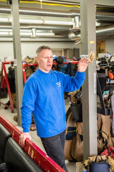 Redmond Smokejumper Program Manager Josh Cantrell explains the purpose of the ready room, cargo room and other spaces within the RAC. 