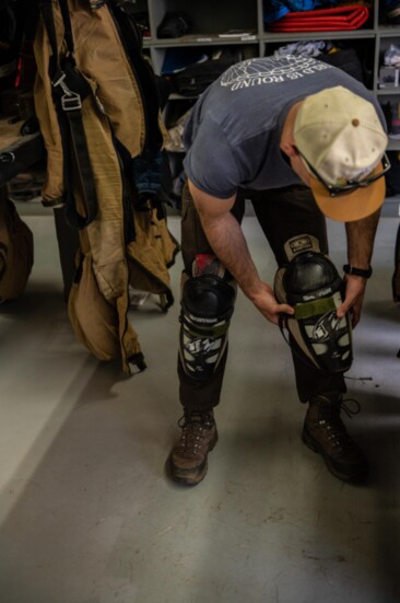 Hockey knee pads are part of Smokejumper Joe Madden's jump gear, all of which is intended to protect him as he jumps into unknown, potentially rugged terrain.