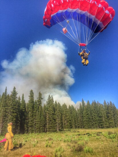 Smokejumpers can "fly" their parachutes and can usually land very close to designated jump sites near remote fires. 